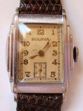 VINTAGE WIND UP BULOVA STEP CASE.RUN GREAT